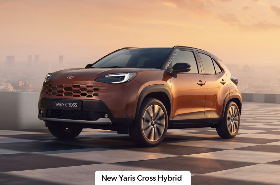 A bronze Toyota Yaris Cross driving