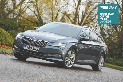 Skoda Superb Estate front quarter with What Car? logo
